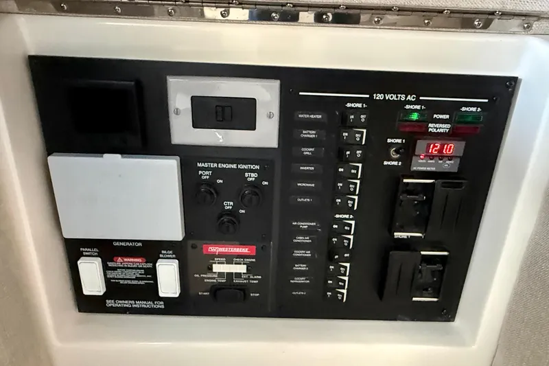  Yacht Photos Pics Control panel of 2022 Sea Ray Sundancer 370 Outboard, featuring various switches and indicators.