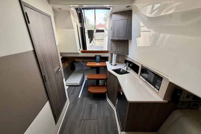  Yacht Photos Pics 2022 Sea Ray Sundancer 370 Outboard interior with modern kitchen and seating area.