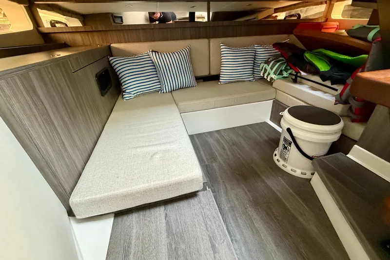  Yacht Photos Pics Interior of 2022 Sea Ray Sundancer 370 Outboard with seating and striped cushions.