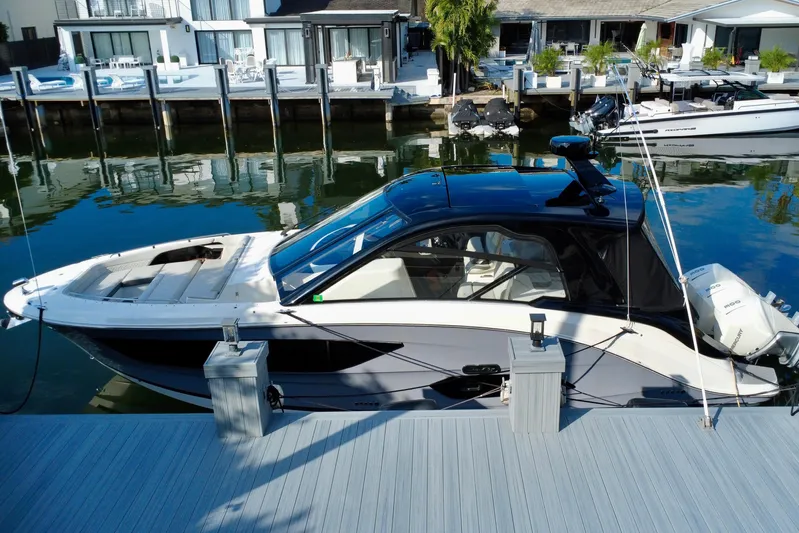  Yacht Photos Pics 2022 Sea Ray Sundancer 370 Outboard docked by waterfront homes.