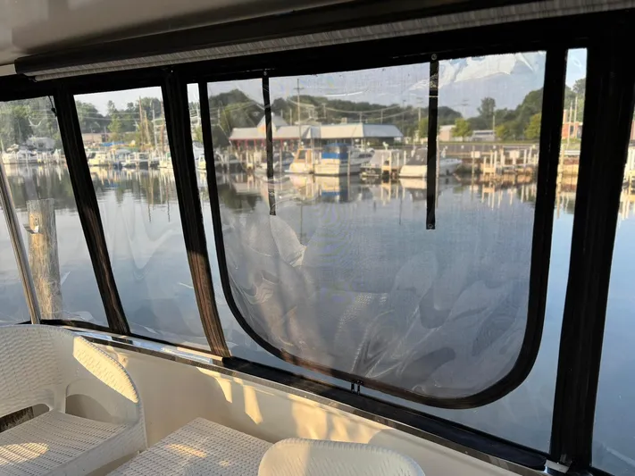 Musketeer Yacht Photos Pics Interior view of 2000 Carver 406 Aft Cabin Motor Yacht overlooking marina.