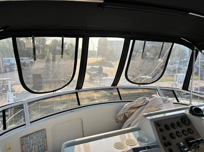 Musketeer Yacht Photos Pics Interior view of 2000 Carver 406 Aft Cabin Motor Yacht cockpit with dashboard and windows.