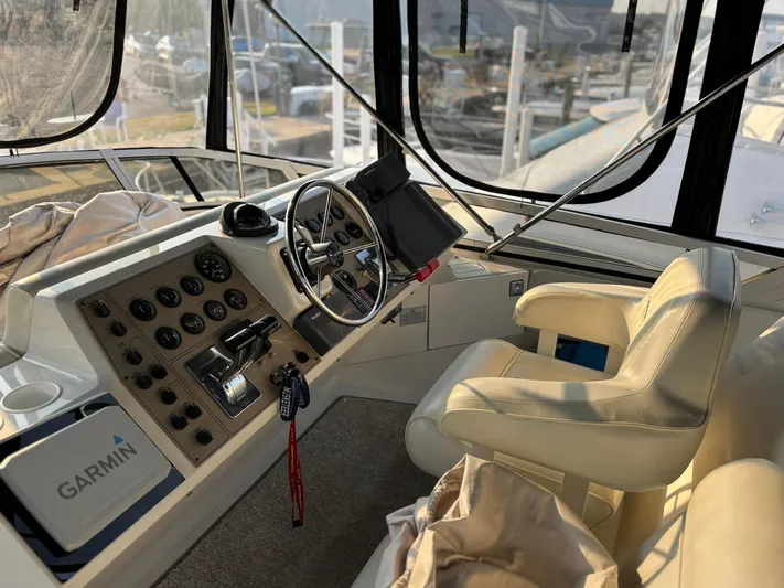 Musketeer Yacht Photos Pics Helm of 2000 Carver 406 Aft Cabin Motor Yacht with Garmin navigation system.