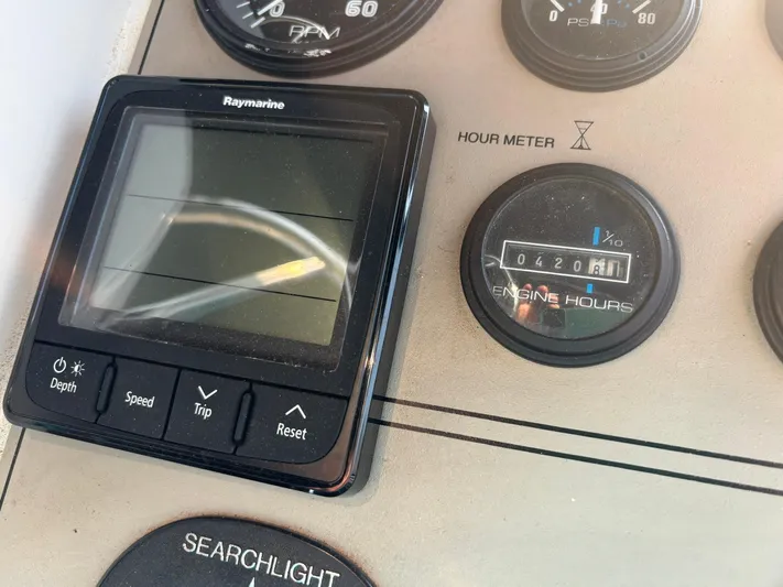 Musketeer Yacht Photos Pics Control panel of 2000 Carver 406 Aft Cabin Motor Yacht with hour meter and Raymarine display.