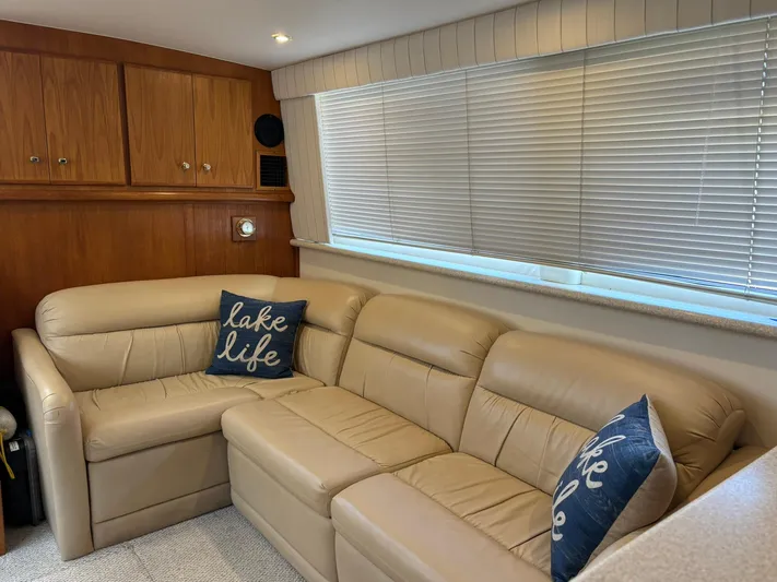 Musketeer Yacht Photos Pics Luxurious interior of 2000 Carver 406 Aft Cabin Motor Yacht with beige leather seating.