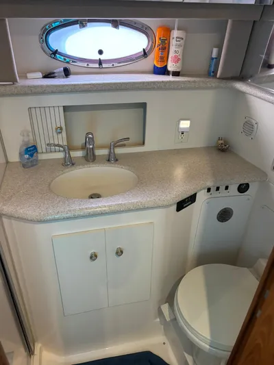 Musketeer Yacht Photos Pics Bathroom interior of 2000 Carver 406 Aft Cabin Motor Yacht with sink and toilet.