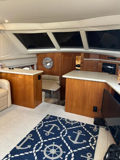 Musketeer Yacht Photos Pics Interior of 2000 Carver 406 Aft Cabin Motor Yacht with nautical decor and wood finishes.