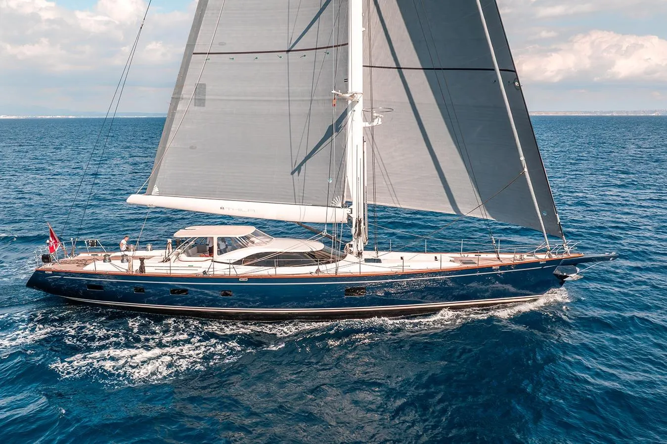 Luxurious 2009 Steve Ward & Co Custom yacht sailing on open blue sea.
