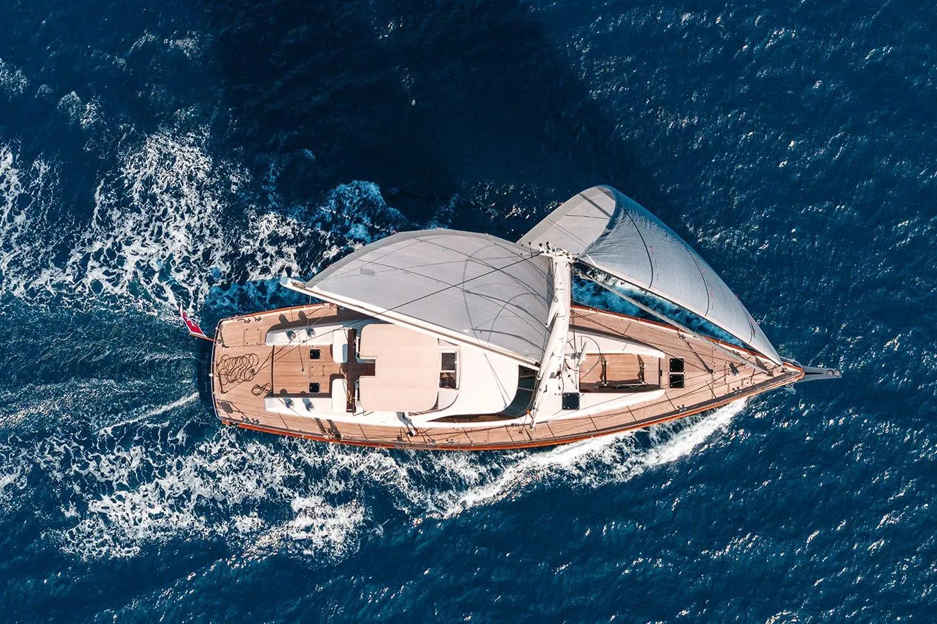Aerial view of 2009 Steve Ward & Co Custom yacht sailing on blue ocean waters.