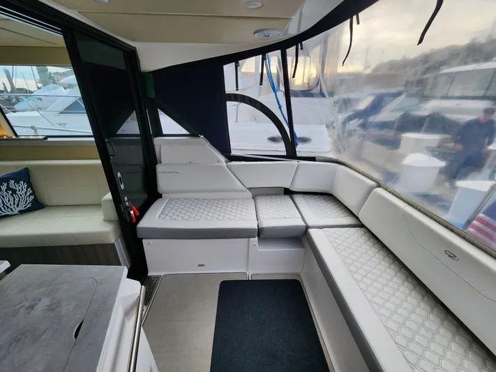 Foxyot Yacht Photos Pics 2022 Regal 38 Grande Coupe interior with luxurious seating and modern design.