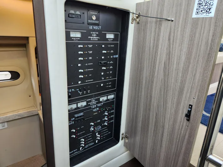 Foxyot Yacht Photos Pics Electrical panel inside 2022 Regal 38 Grande Coupe yacht, showcasing control switches.