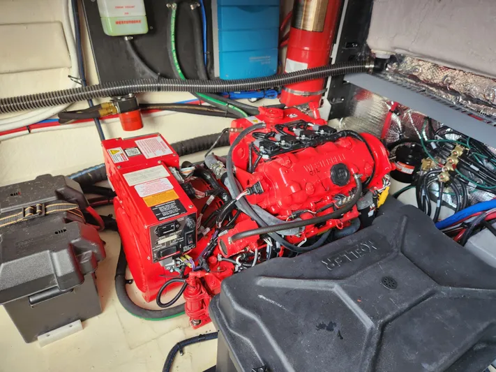 Foxyot Yacht Photos Pics Engine room of 2022 Regal 38 Grande Coupe with red engine and wiring.