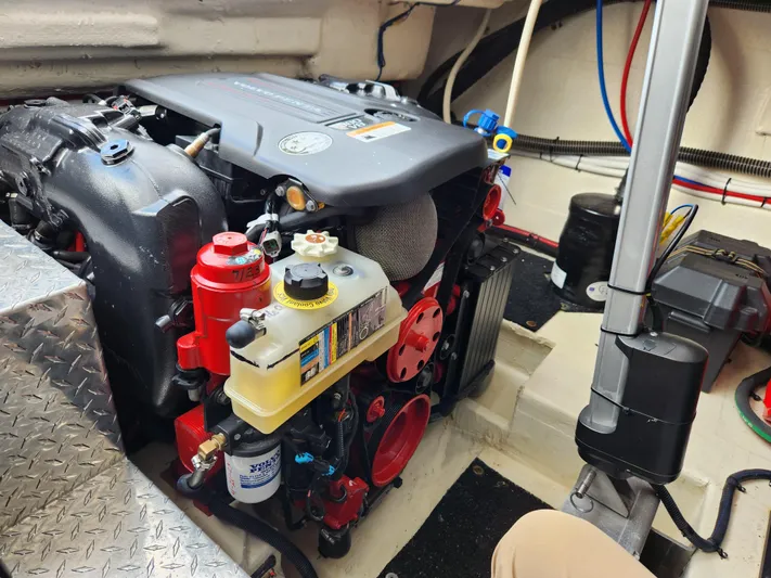 Foxyot Yacht Photos Pics Engine compartment of 2022 Regal 38 Grande Coupe, showcasing detailed mechanical components.