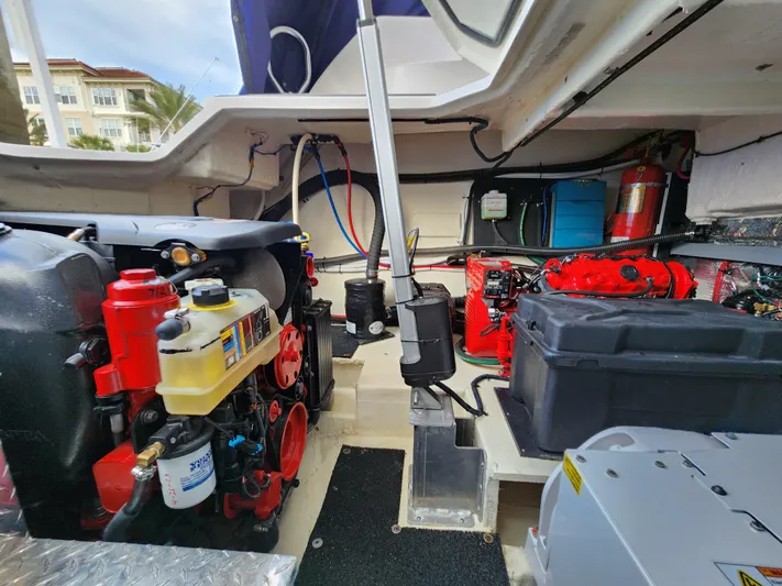 Foxyot Yacht Photos Pics Engine room of 2022 Regal 38 Grande Coupe, showcasing mechanical components and systems.
