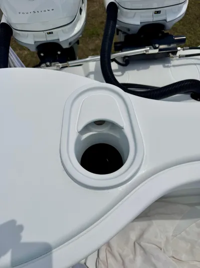  Yacht Photos Pics 2020 Yellowfin 39 Offshore boat detail with outboard motors and cup holder.