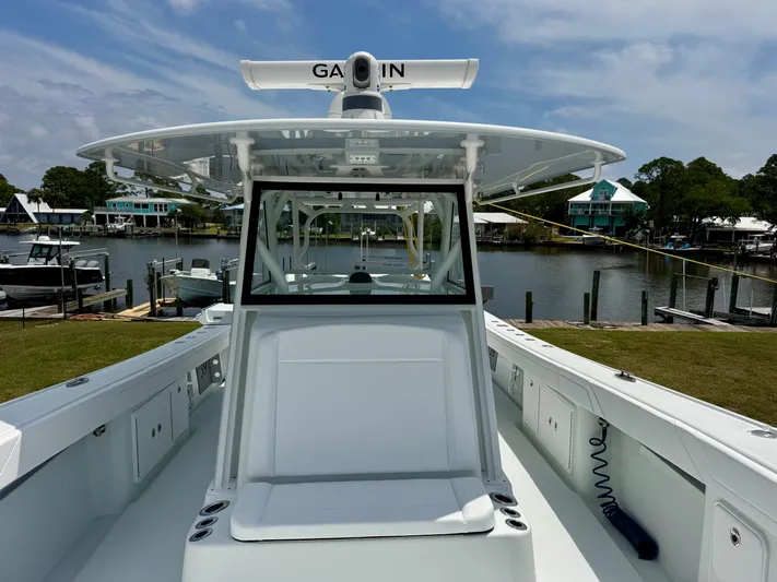  Yacht Photos Pics 2020 Yellowfin 39 Offshore boat docked by a scenic waterfront.