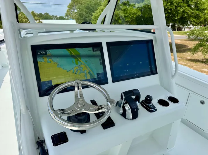 Yacht Photos Pics 2020 Yellowfin 39 Offshore boat dashboard with dual screens and steering wheel.