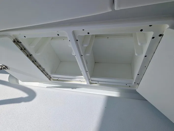  Yacht Photos Pics 2020 Yellowfin 39 Offshore storage compartments, open and empty, showcasing interior space.