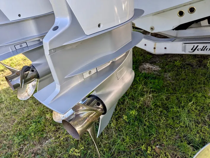  Yacht Photos Pics 2020 Yellowfin 39 Offshore boat propellers on grassy surface.