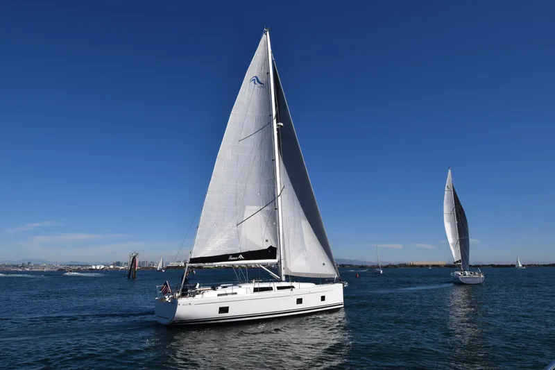 Hanse 418 #303 San Yacht Photos Pics 2023 Hanse 418 sailboat on open water under clear blue sky.
