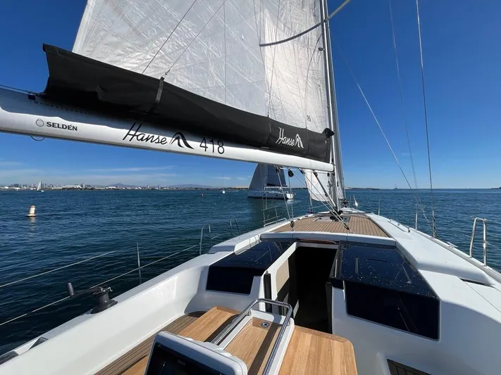 Hanse 418 #303 San Yacht Photos Pics 2023 Hanse 418 sailboat on open water, clear skies, and sleek design.