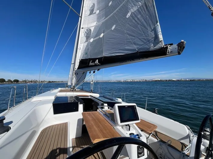 Hanse 418 #303 San Yacht Photos Pics 2023 Hanse 418 sailboat on calm waters, featuring sleek deck and modern navigation equipment.