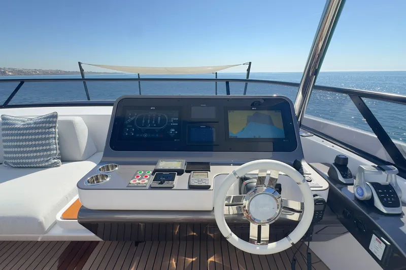  Yacht Photos Pics Helm of 2025 Azimut Grande 26M yacht with modern navigation equipment and ocean view.