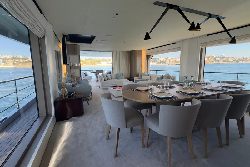  Yacht Photos Pics Luxurious interior of 2025 Azimut Grande 26M yacht with elegant dining area and scenic ocean views.