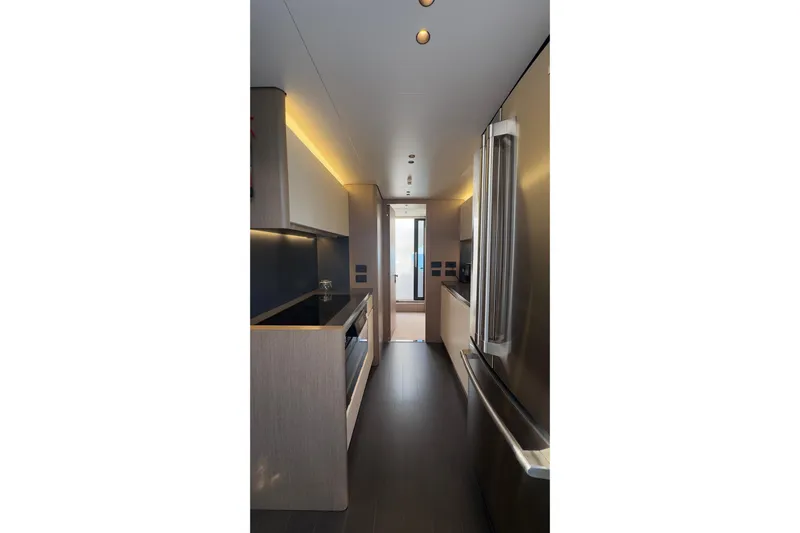  Yacht Photos Pics Modern kitchen interior of 2025 Azimut Grande 26M yacht, featuring sleek design and stainless steel appliances.