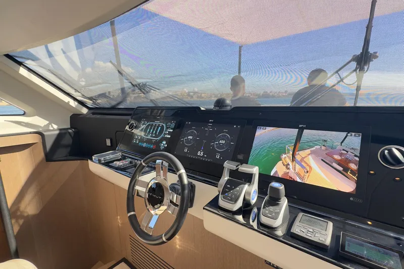  Yacht Photos Pics Helm of 2025 Azimut Grande 26M yacht with advanced navigation controls and displays.