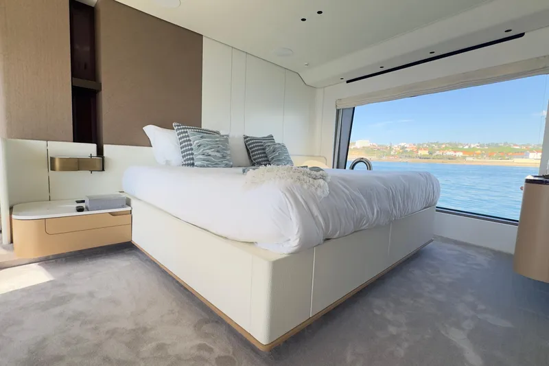  Yacht Photos Pics Luxurious bedroom interior of 2025 Azimut Grande 26M yacht with ocean view.
