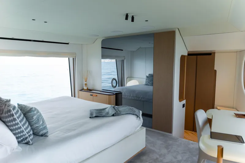  Yacht Photos Pics Luxurious bedroom interior of 2025 Azimut Grande 26M yacht with ocean view.