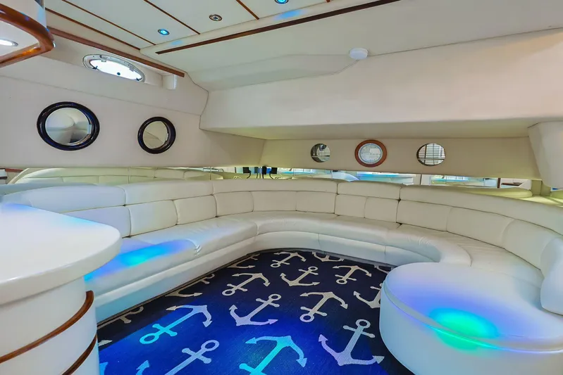  Yacht Photos Pics Luxurious 1994 Sea Ray 500 Sundancer yacht interior with white seating and nautical-themed decor.