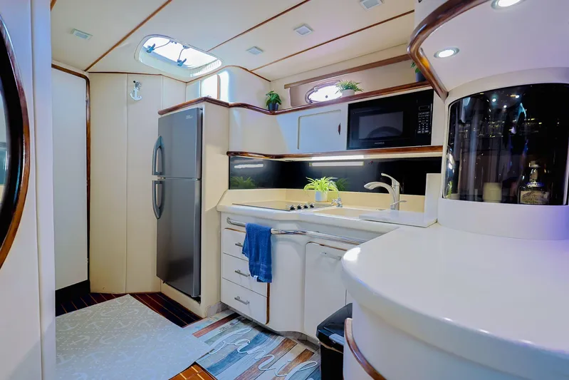  Yacht Photos Pics Luxurious 1994 Sea Ray 500 Sundancer yacht kitchen with modern appliances and elegant design.