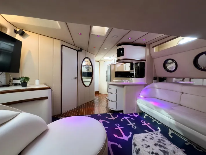  Yacht Photos Pics Luxurious interior of 1994 Sea Ray 500 Sundancer yacht with modern amenities and stylish decor.