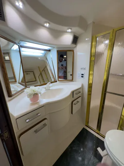  Yacht Photos Pics Luxurious bathroom in 1994 Sea Ray 500 Sundancer yacht with elegant fixtures and spacious design.