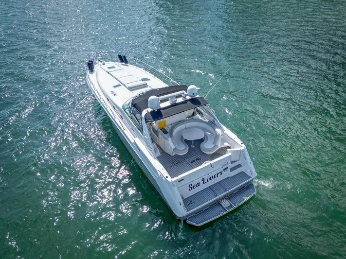  Yacht Photos Pics 1994 Sea Ray 500 Sundancer yacht cruising on clear blue water.