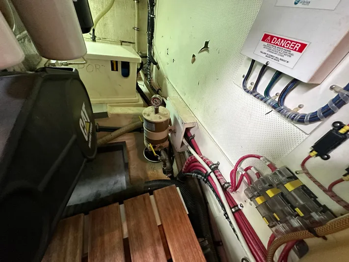 Vivacious Yacht Photos Pics Engine room of 2002 Grand Banks Eastbay 43 with CAT engine and electrical components.