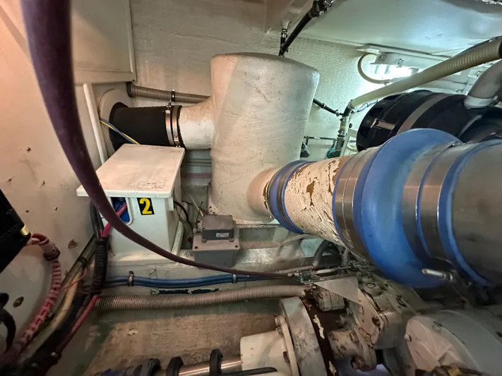 Vivacious Yacht Photos Pics Engine room of 2002 Grand Banks Eastbay 43, showcasing exhaust system and components.