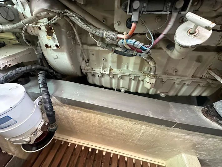 Vivacious Yacht Photos Pics Engine compartment of a 2002 Grand Banks Eastbay 43, showing mechanical components and wiring.