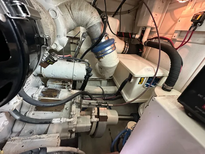 Vivacious Yacht Photos Pics Engine room of 2002 Grand Banks Eastbay 43 with visible pipes and machinery.