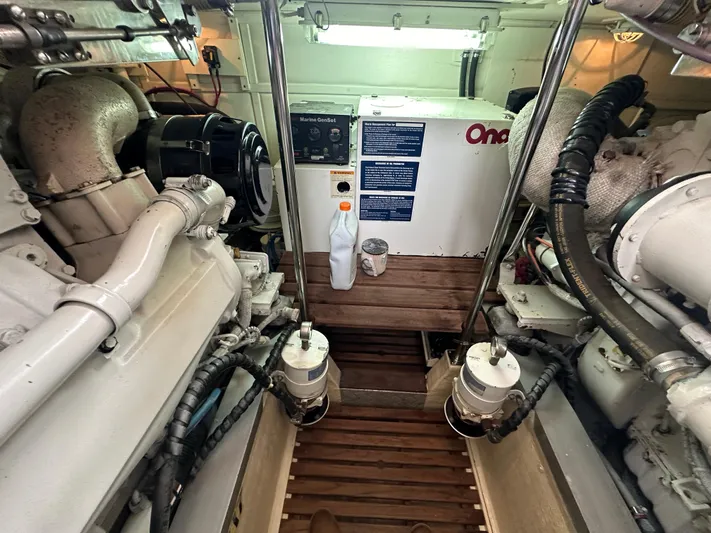 Vivacious Yacht Photos Pics Engine room of 2002 Grand Banks Eastbay 43 with visible machinery and equipment.