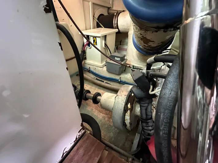 Vivacious Yacht Photos Pics Engine room of 2002 Grand Banks Eastbay 43, showcasing mechanical components and piping.