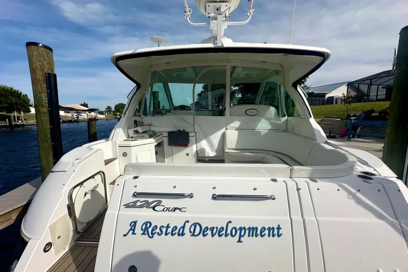  Yacht Photos Pics 2011 Cruisers Yachts 420 Sports Coupe docked, featuring spacious seating and sleek design.