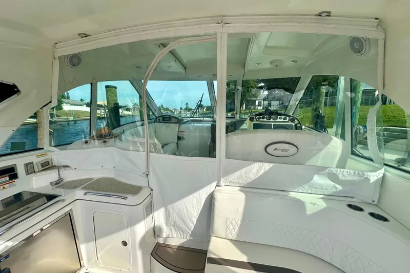  Yacht Photos Pics 2011 Cruisers Yachts 420 Sports Coupe interior with helm and seating area.