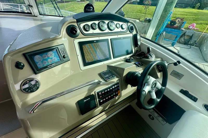  Yacht Photos Pics Helm of 2011 Cruisers Yachts 420 Sports Coupe with advanced navigation controls and displays.