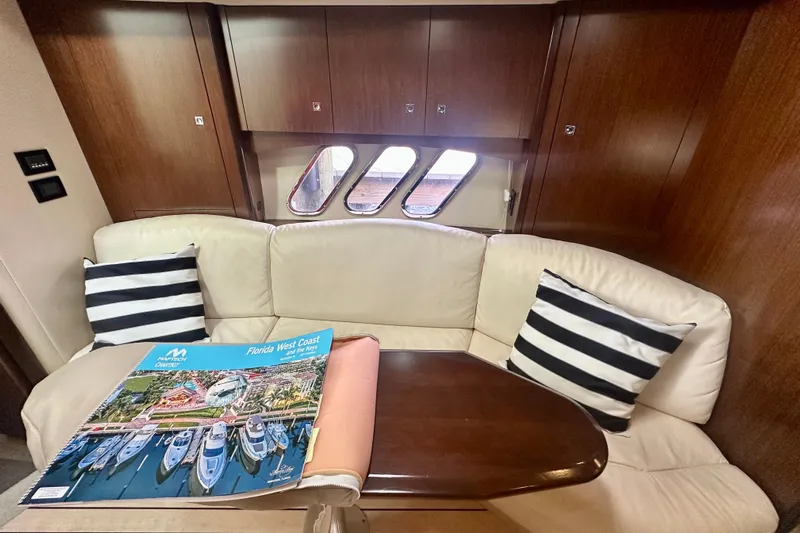  Yacht Photos Pics Luxurious interior of 2011 Cruisers Yachts 420 Sports Coupe with plush seating and nautical decor.