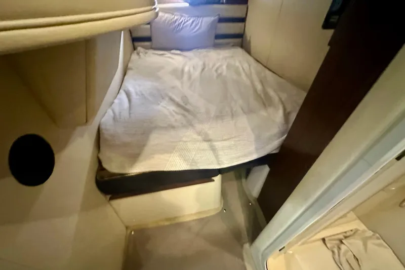  Yacht Photos Pics 2011 Cruisers Yachts 420 Sports Coupe cabin interior with cozy bed and modern design.