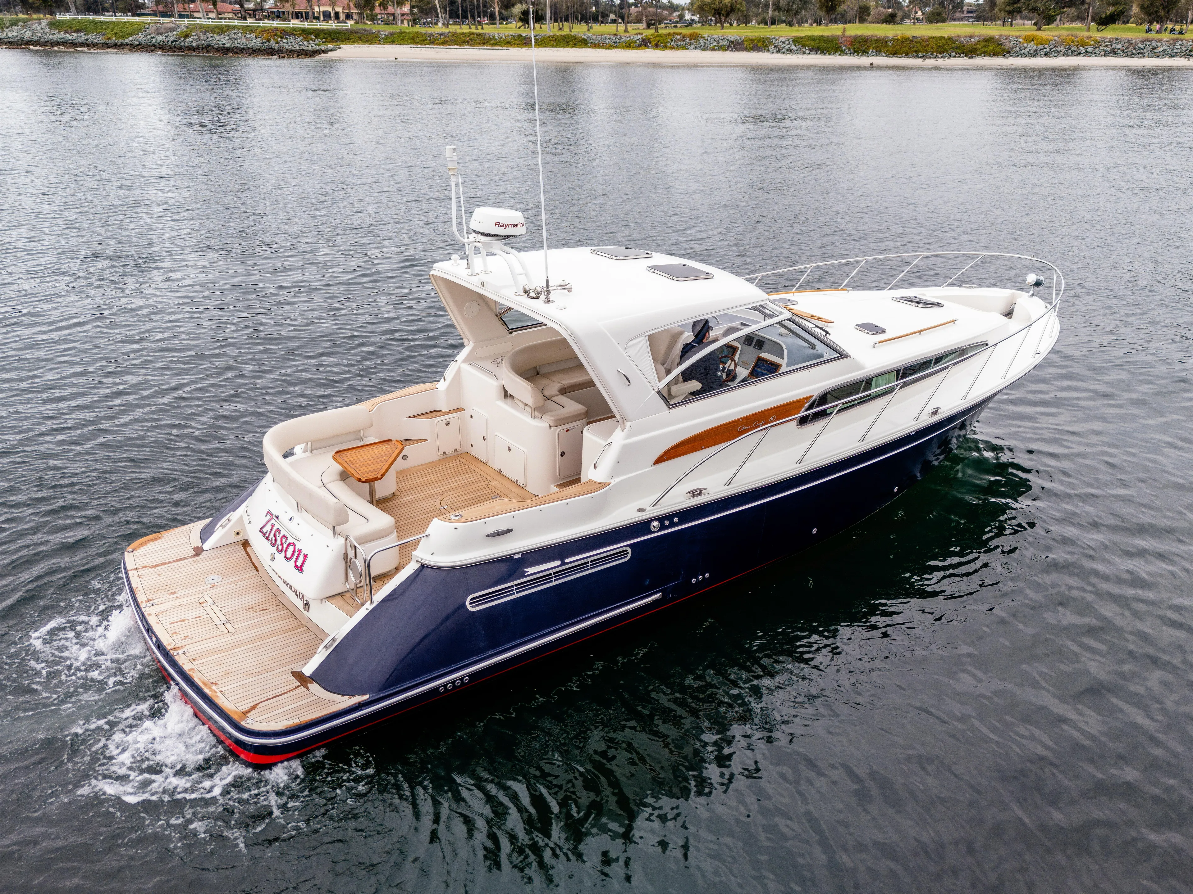 Zissou Yacht Photos Pics 2006 Chris-Craft Roamer 40 yacht cruising on calm waters.