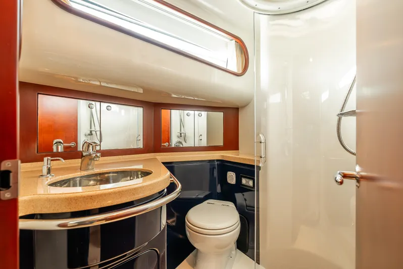 Zissou Yacht Photos Pics Luxurious bathroom in 2006 Chris-Craft Roamer 40 yacht with modern fixtures and elegant design.